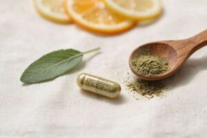 Natural supplement capsule on white linen with herbs and citrus representing Berzeo metabolic formula